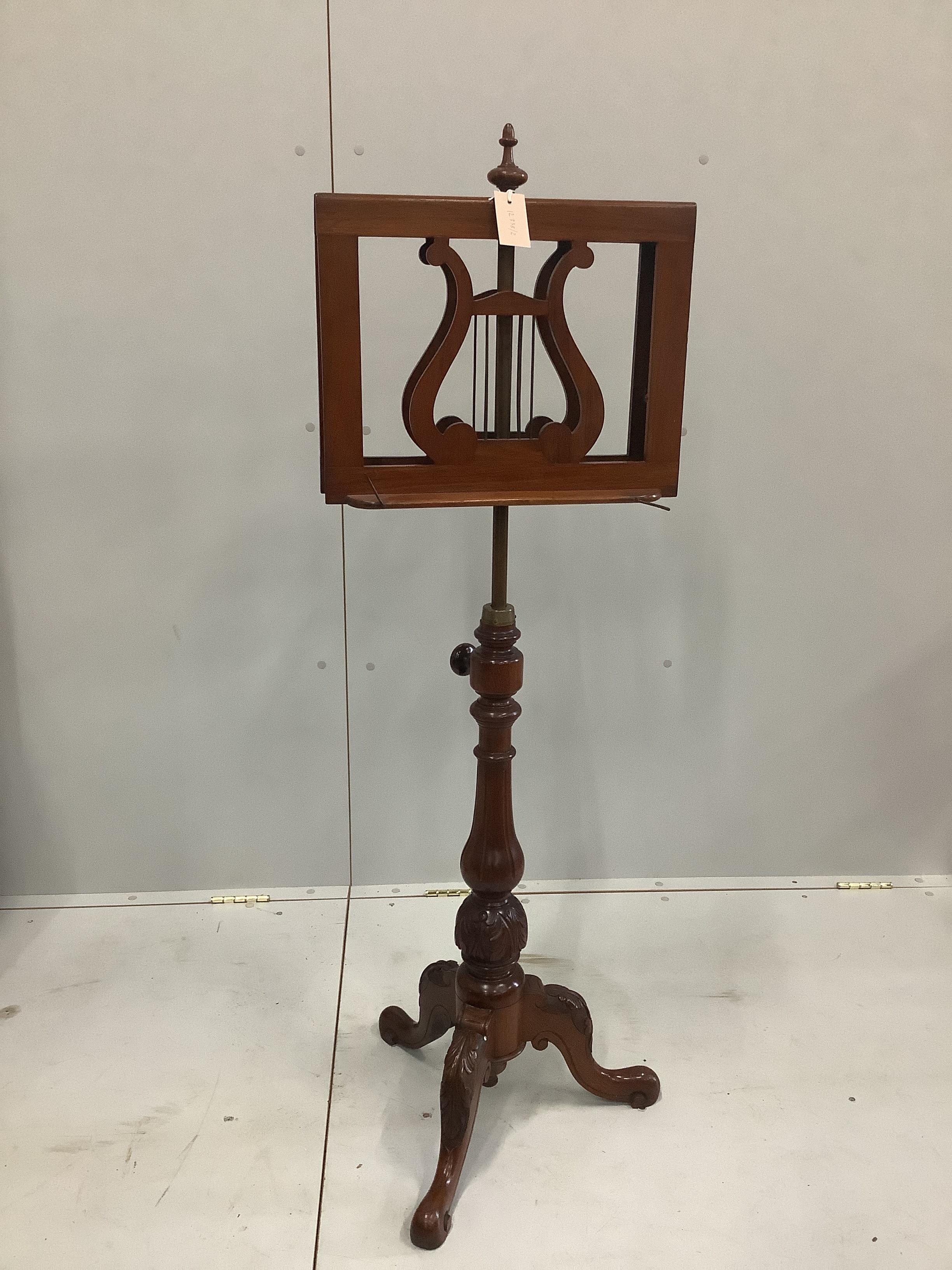 A Victorian mahogany duet music stand, with adjustable stem (af)